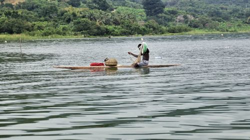 Fisherman fishing in river