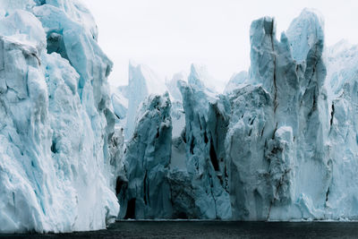 Panoramic view of frozen sea against sky