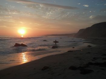 Scenic view of sea at sunset