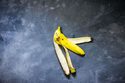 Directly above shot of banana peel on gray table