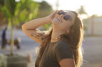 Portrait of young woman wearing sunglasses