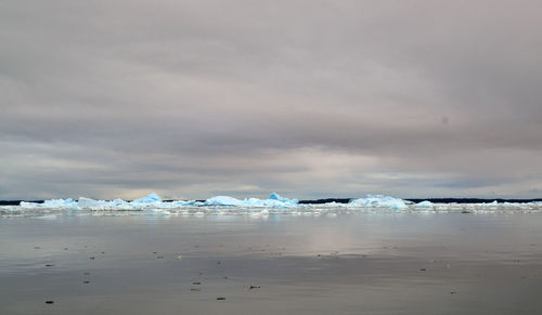 Scenic view of sea against sky during winter