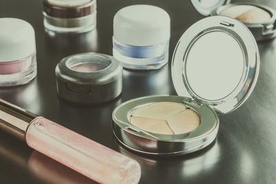 High angle view of make-up products on table