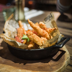 Food in container on cutting board