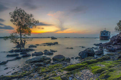 Scenic view of sea against sky during sunset