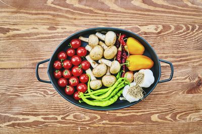 High angle view of green peas in bowl on table