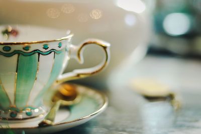 Close-up of coffee cup on table