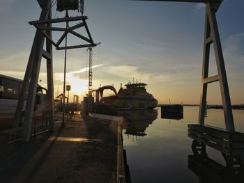 View of harbor at sunset