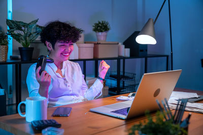 Female doctor working at desk in office