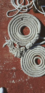 Directly above shot of ropes on footpath 