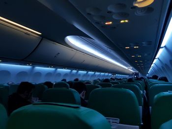 Rear view of people sitting in airplane
