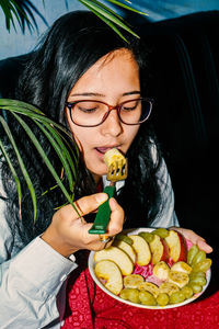 Portrait of young woman eating food. women need quality food for diet.