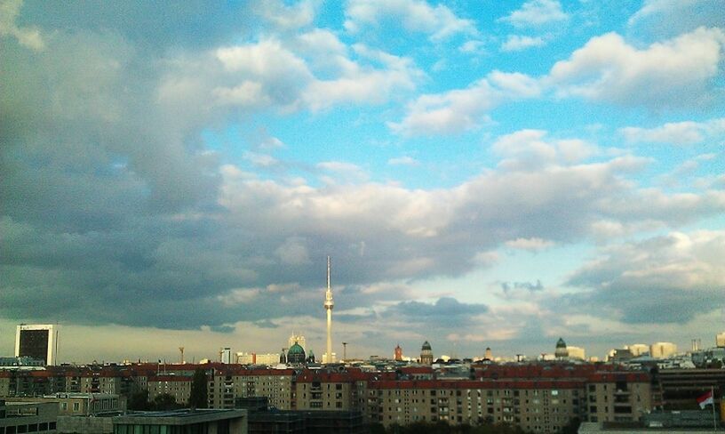 building exterior, architecture, built structure, sky, cloud - sky, city, cloudy, cityscape, cloud, residential district, residential building, tower, day, communications tower, residential structure, outdoors, tall - high, crowded, no people, building