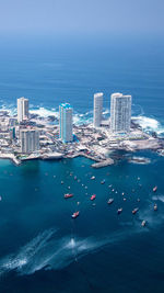 High angle view of cityscape by sea