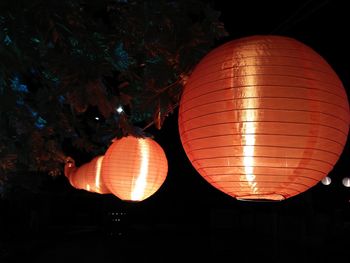 Illuminated lanterns hanging at night