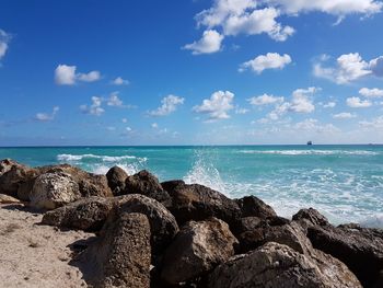 Scenic view of sea against blue sky