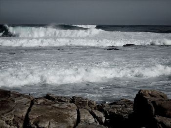 Waves splashing on rocks