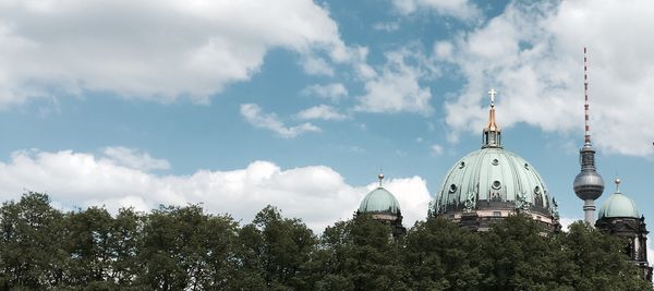 Low angle view of berlin cathedral against cloudy sky