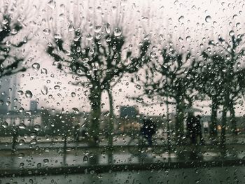 Full frame shot of wet glass window in rainy season