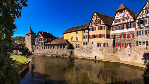 Idyllic panorama in a german old town on a river with city wall and half-timbered houses