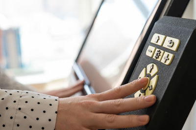 Cropped hand of man using mobile phone