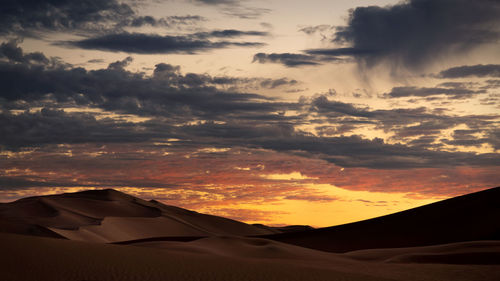 Scenic view of dramatic sky during sunset