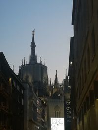 Panoramic view of buildings in city against clear sky