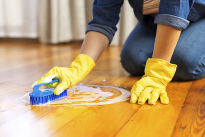 Low section of man preparing food on table