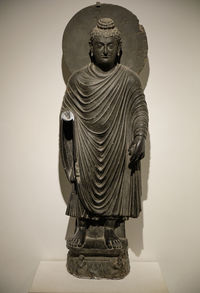 Statue of buddha against white background