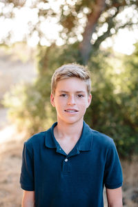 Portrait of young man standing outdoors