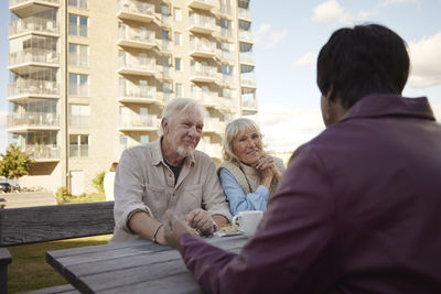 People having coffee together