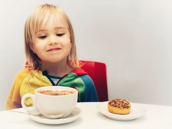 Portrait of woman with coffee cup