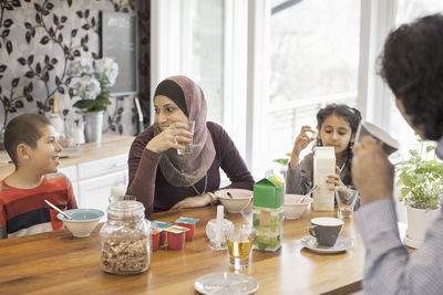 Muslim family having breakfast together at home