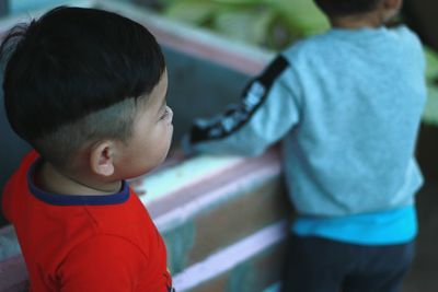 Siblings standing in park