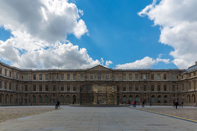 Historic building against cloudy sky