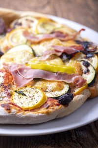 Close-up of pizza served on table