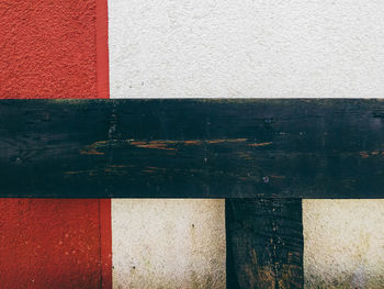 Green wooden plank against wall