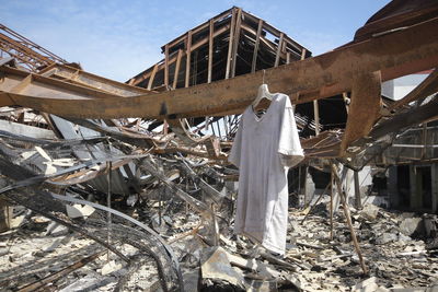 Low angle view of clothes drying on roof against building