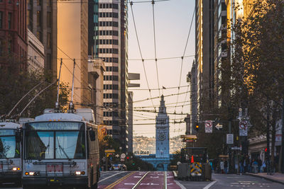 View of city street and buildings against sky