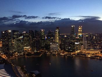 Aerial view of city lit up at night