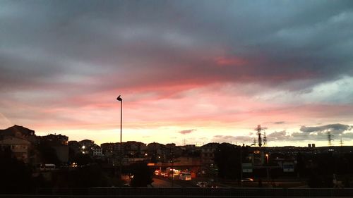 Clouds over city at sunset