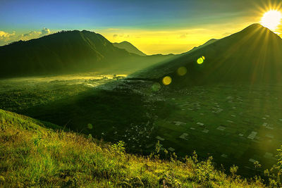 Scenic view of landscape against sky during sunset