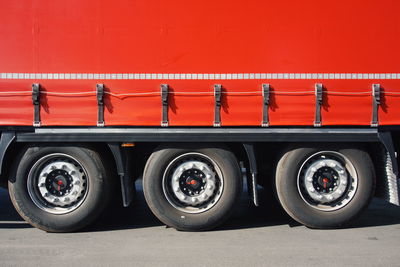 Cropped image of red truck on road