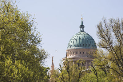 Low angle view of bell tower against sky