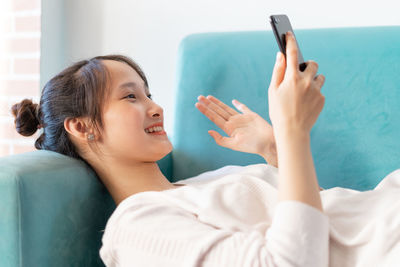 Young woman using mobile phone