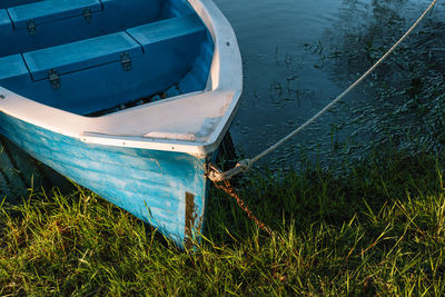 Docked blue fishing boat