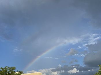 Low angle view of rainbow against sky
