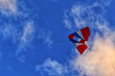 Low angle view of flag against sky