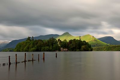 Scenic view of lake and mountains against sky