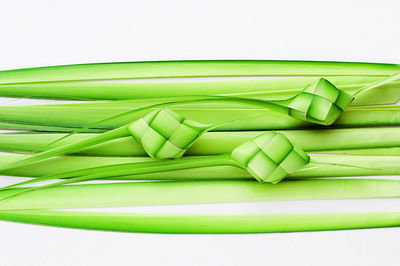 Close-up of chopped green beans against white background